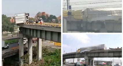 (VIDEO) Tráiler 'pende de un hilo' tras volcar en puente del Circuito Mexiquense