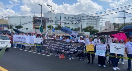 Bloquean caseta de acceso a la capital trabajadores del Poder Judicial de la Federación