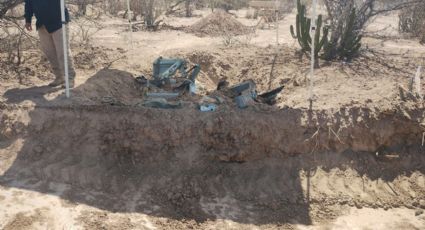 Hallan vehículo de policías estatales desaparecidos enterrado en el desierto de La Paz